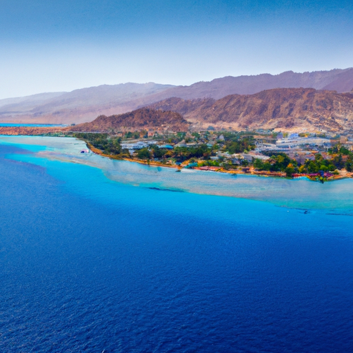 An image showing the crystal-clear waters of the Red Sea with a view of Eilat's shoreline.